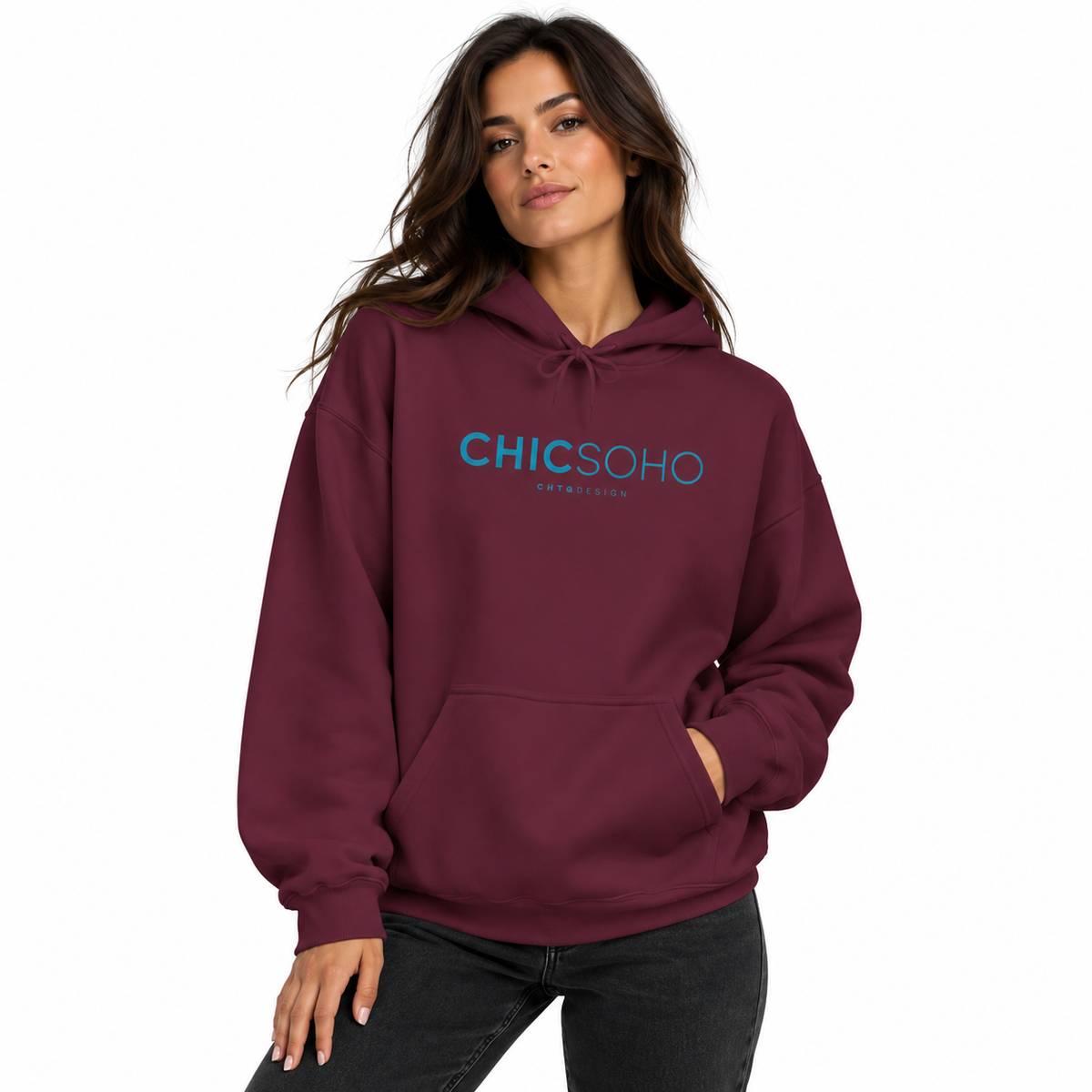 A woman modeling a maroon pullover hoodie with a blue and white 'CHICSOHO' graphic on the chest, paired with black jeans against a plain white background.