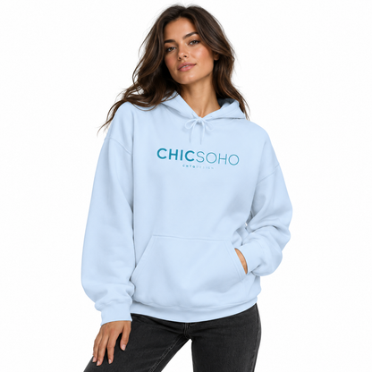 A woman modeling a light blue pullover hoodie with 'CHICSOHO' printed in teal across the chest, paired with dark gray jeans against a plain white background.