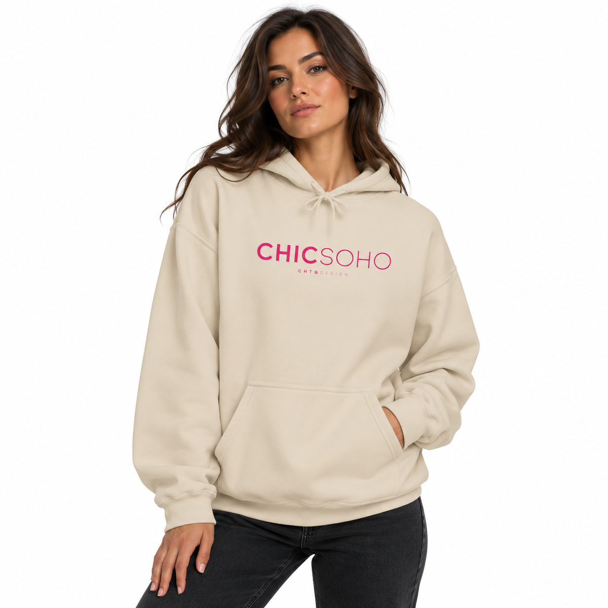 A woman modeling a cream-colored hoodie with a pink 'CHICSOHO' logo on the chest, paired with black jeans, against a plain white background.