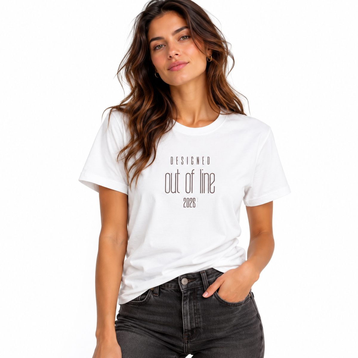 Female model wearing a white Designed Out of Line 2026 graphic T-shirt with black jeans against a white studio background.