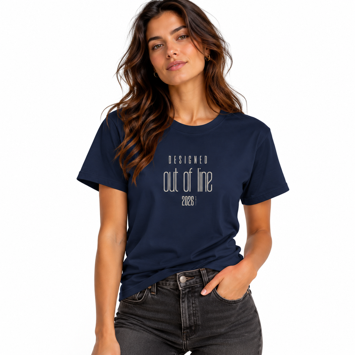 Female model wearing a navy blue Designed Out of Line 2026 graphic T-shirt with black jeans against a white studio background.