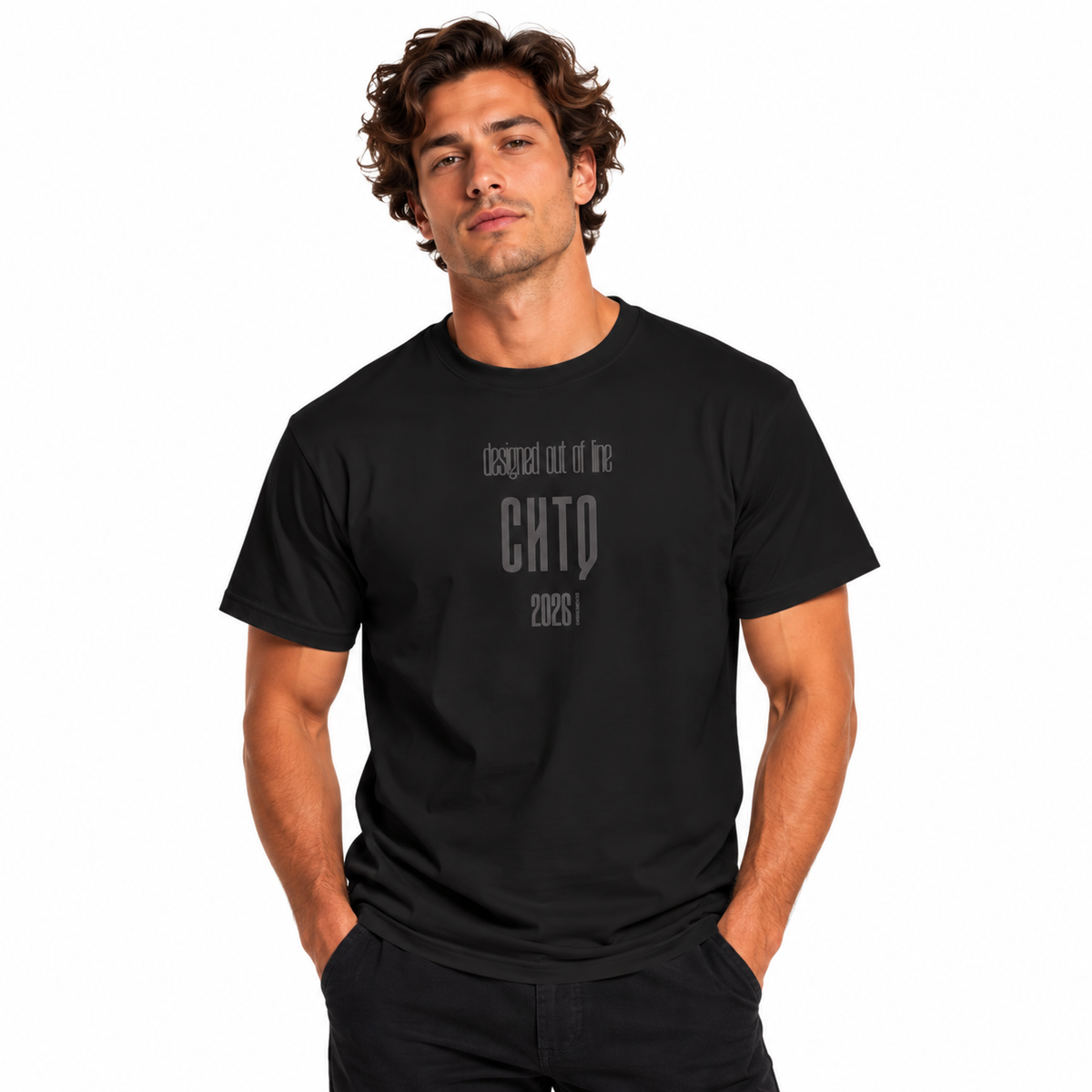 Male model wearing a black Designed Out of Line CHTQ Graphic T-Shirt with gray typography, paired with black trousers against a white studio background.