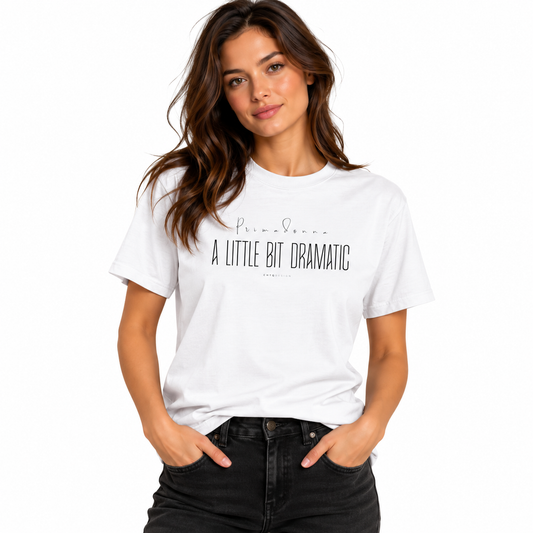 Woman modeling a white PRIMADONNA A Little Bit Dramatic graphic T-shirt with black jeans on a white background