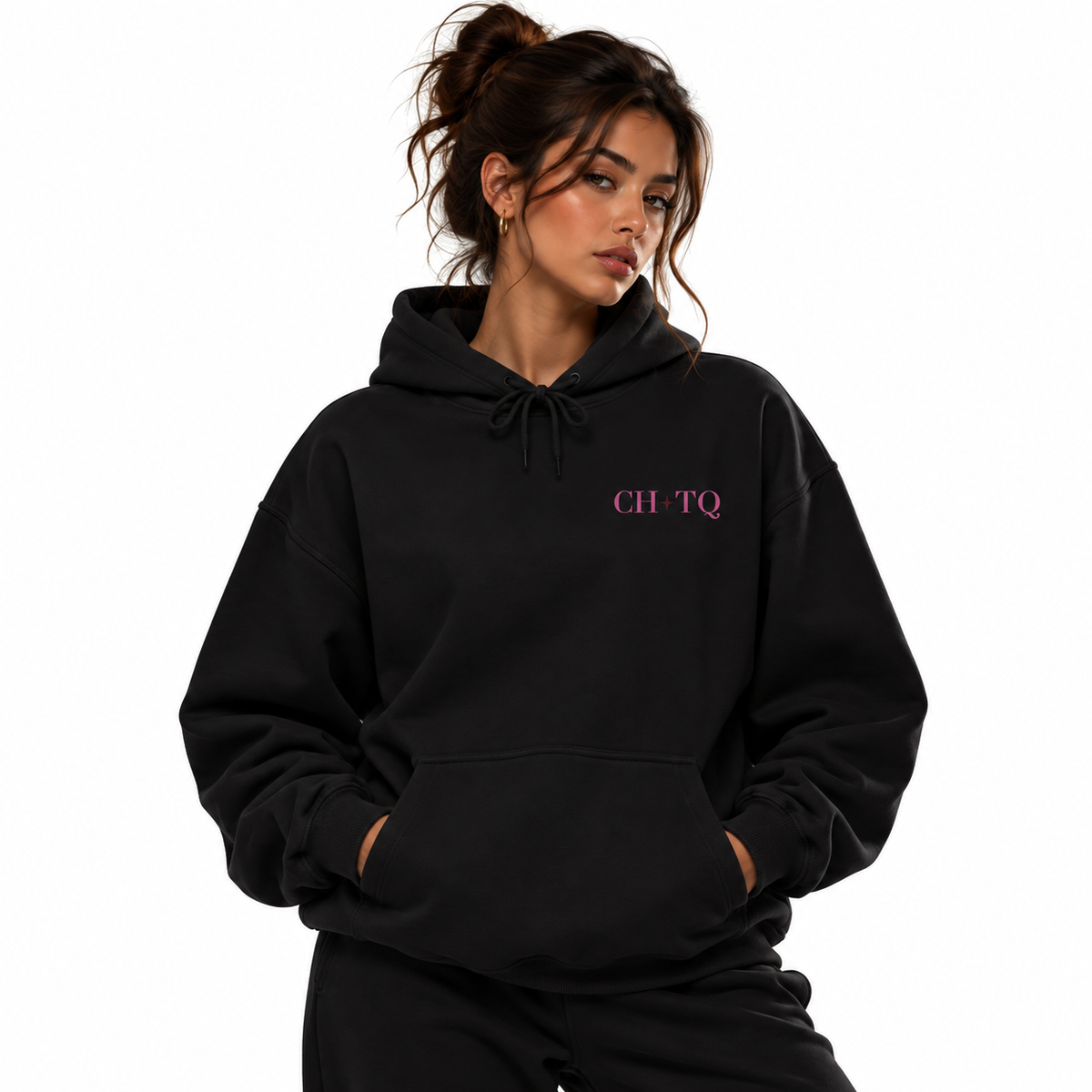 A woman wearing a black pullover hoodie with 'CH-TQ' printed in pink on the left chest, posed against a solid white background.