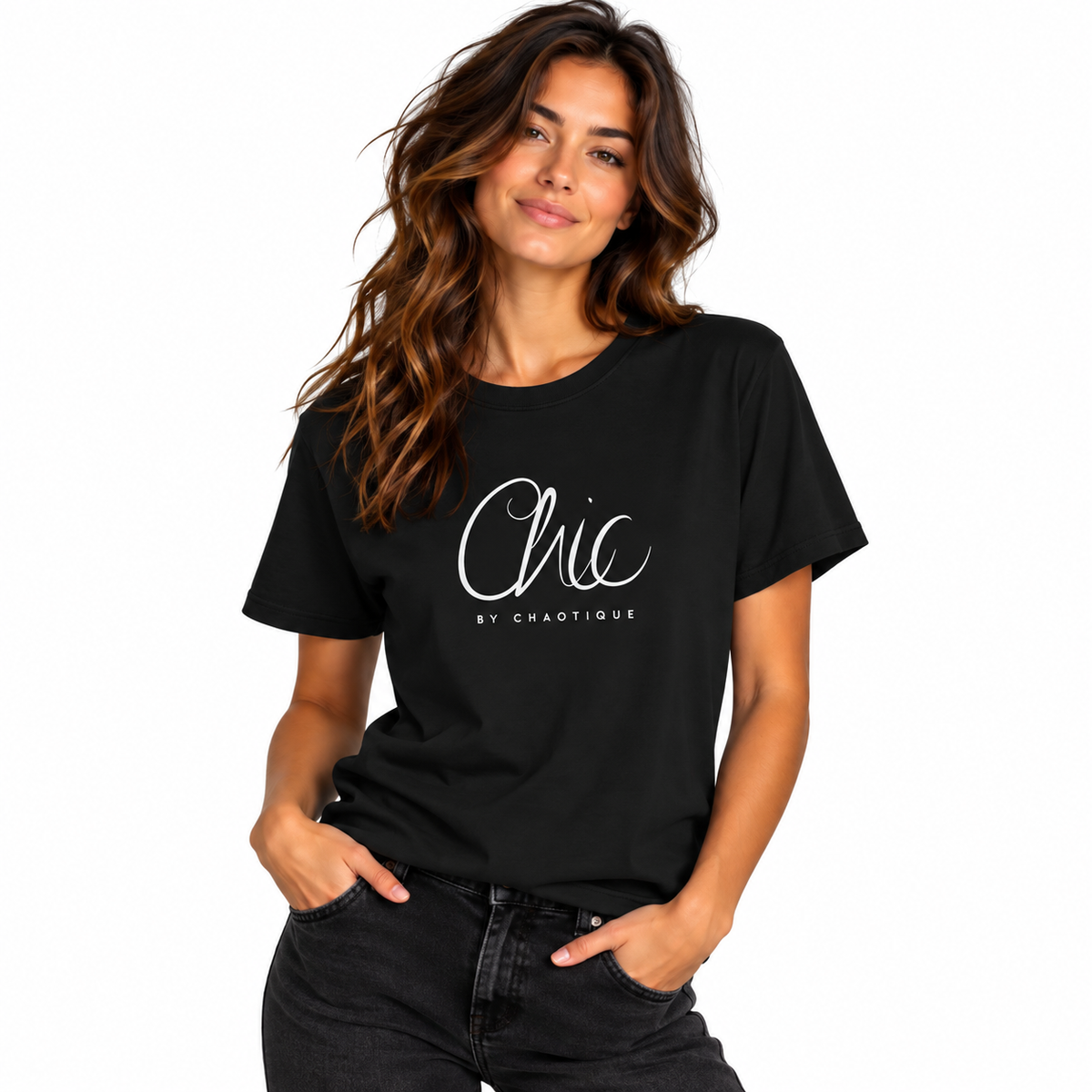 Woman modeling a black Chic by Chaotique graphic T-shirt with dark denim jeans against a white studio background.