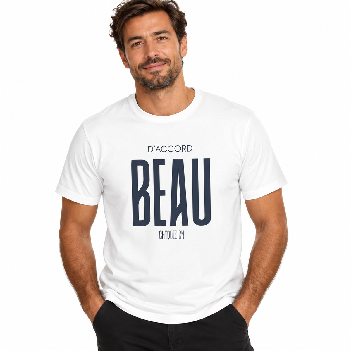 Male model wearing a white D’ACCORD BEAU Graphic T-Shirt by CHTQ Design with dark navy typography and black trousers against a white studio background.