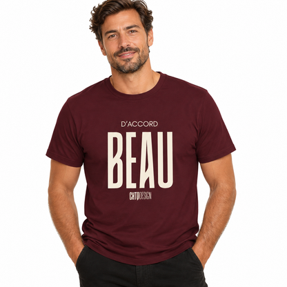 Male model wearing a maroon D’ACCORD BEAU Graphic T-Shirt by CHTQ Design with cream front print and black trousers in a white studio setting.