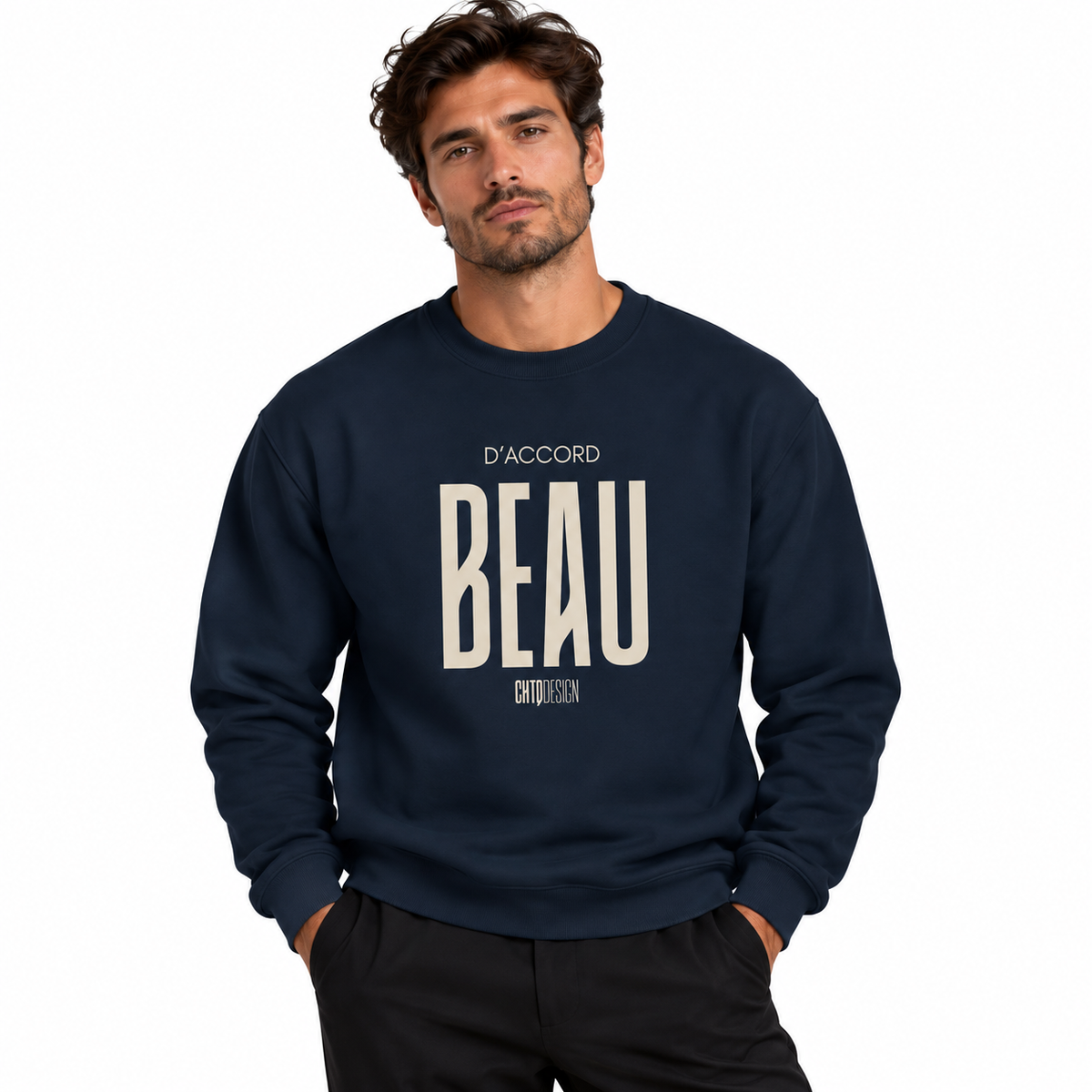 A man wearing a navy blue crewneck sweatshirt with 'BEAU D'ACCORD' printed in cream on the front, paired with black pants, set against a plain white background.