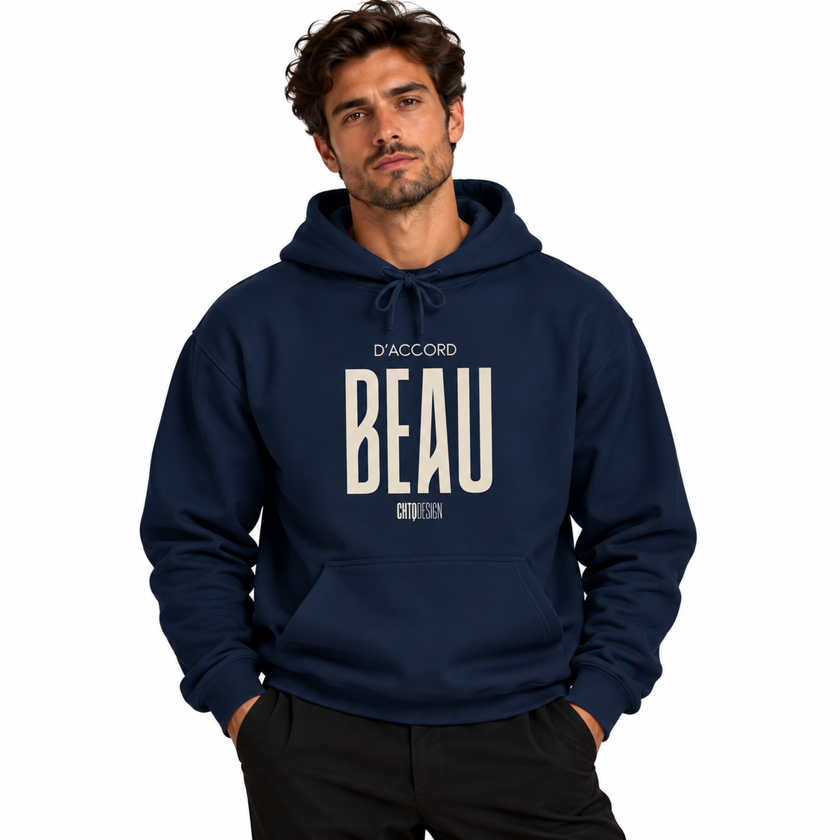 A man wearing a navy blue hoodie with 'D'ACCORD BEAU' printed in cream on the chest, posed against a solid white background.