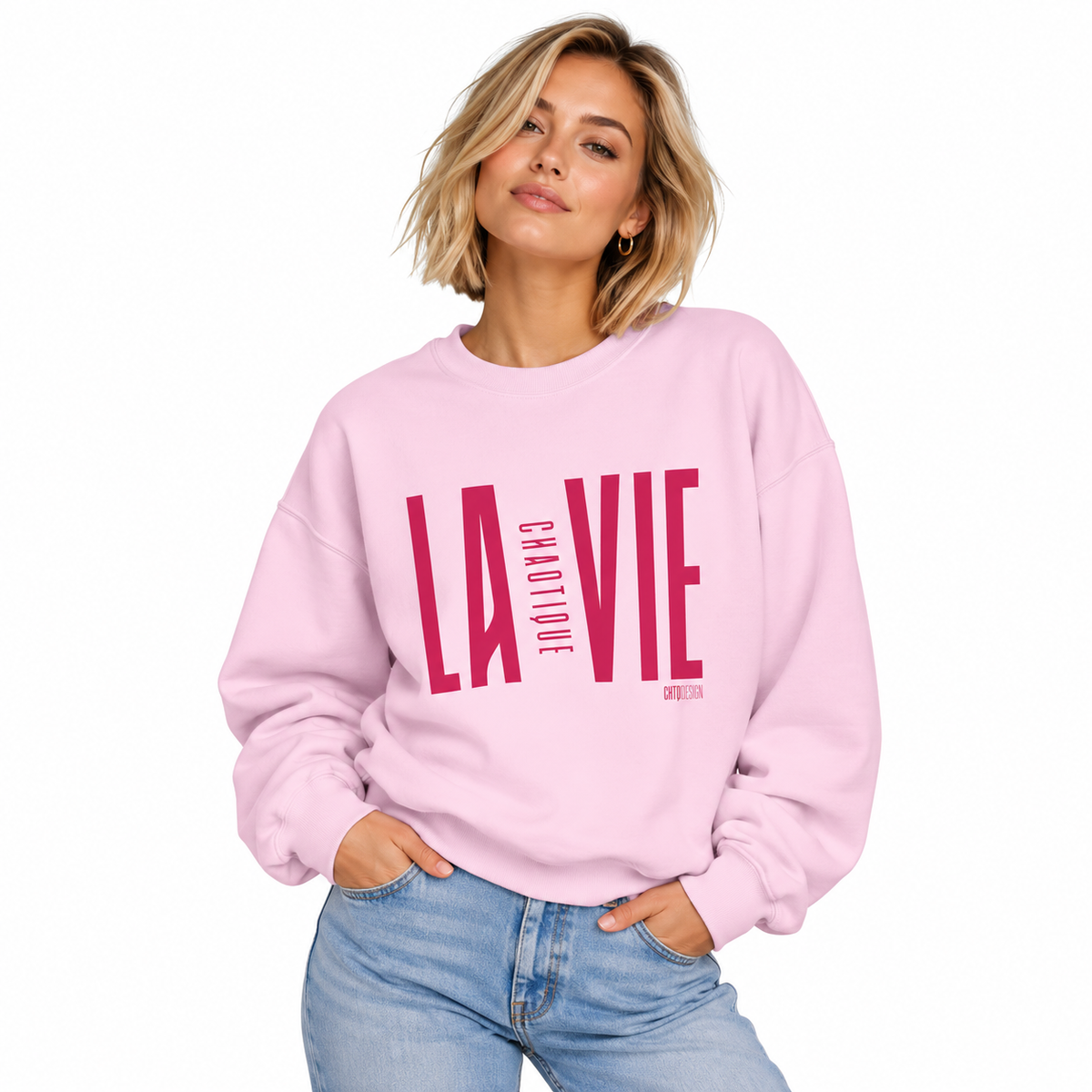 Woman wearing light pink LA VIE CHAOTIQUE crewneck sweatshirt with magenta graphic