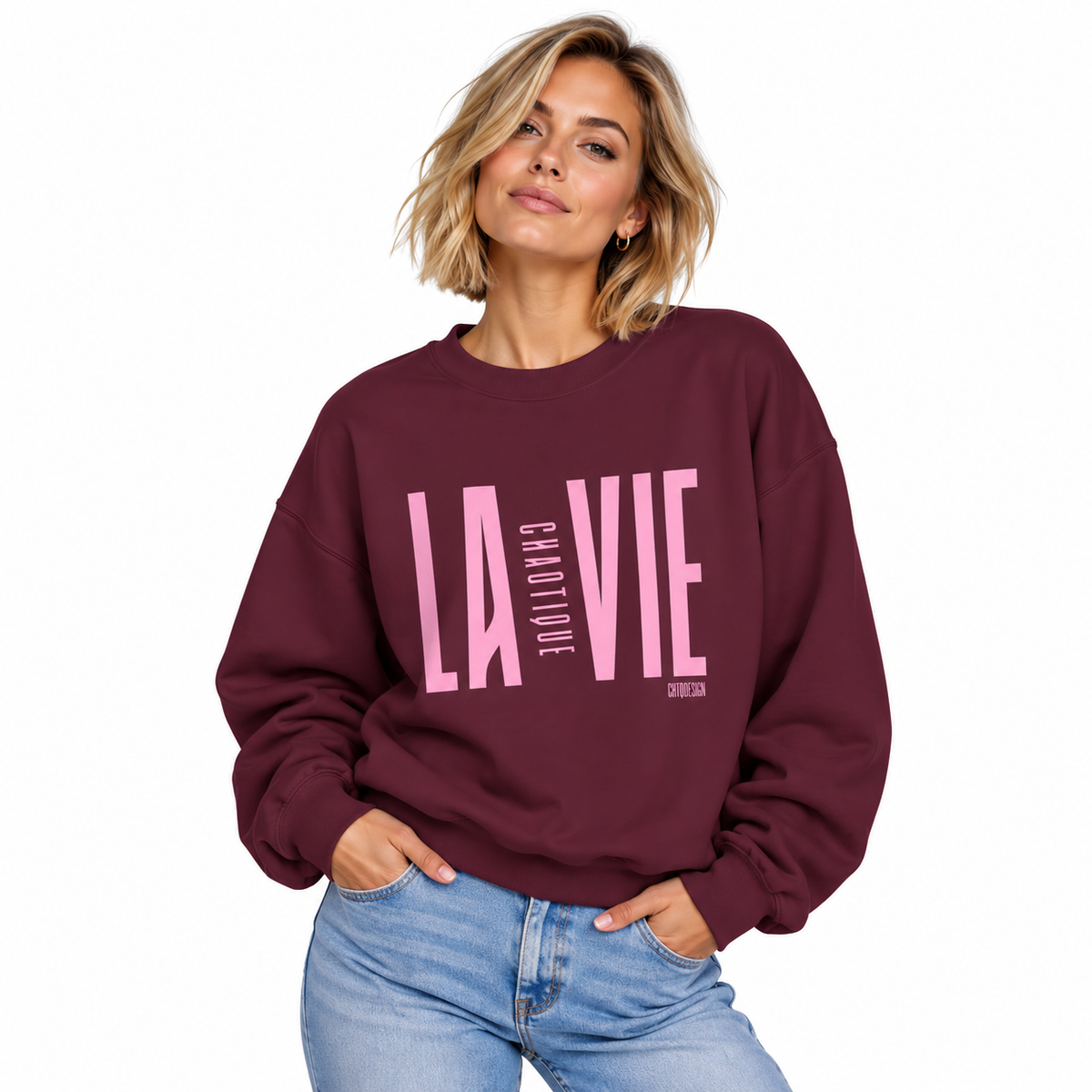 Woman wearing maroon LA VIE CHAOTIQUE crewneck sweatshirt with light pink graphic
