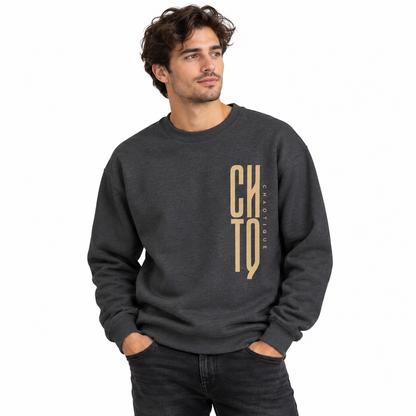 Male model wearing a dark gray CHTQ CHAOTIQUE men's crewneck sweatshirt with vertical CHTQ graphic and CHAOTIQUE lettering, front view on a white studio background.