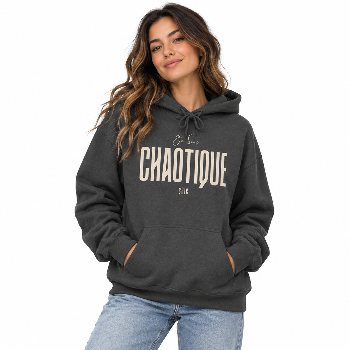 Woman wearing a dark charcoal gray Je Suis CHAOTIQUE CHIC graphic hoodie with cream lettering and casual light blue jeans.