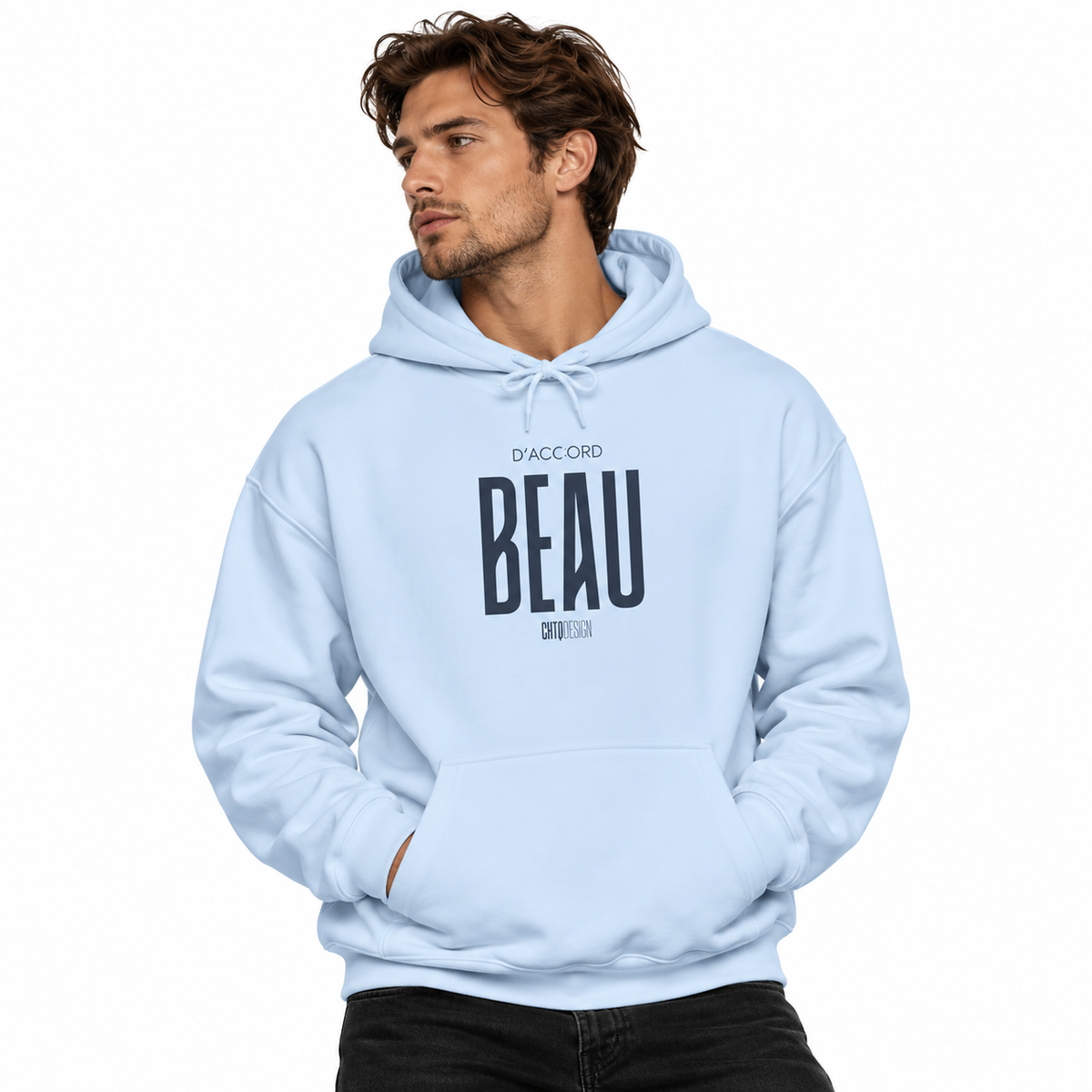 A man wearing a light blue pullover hoodie with a black graphic print on the chest reading 'D'ACCORD BEAU' posed against a solid white background.