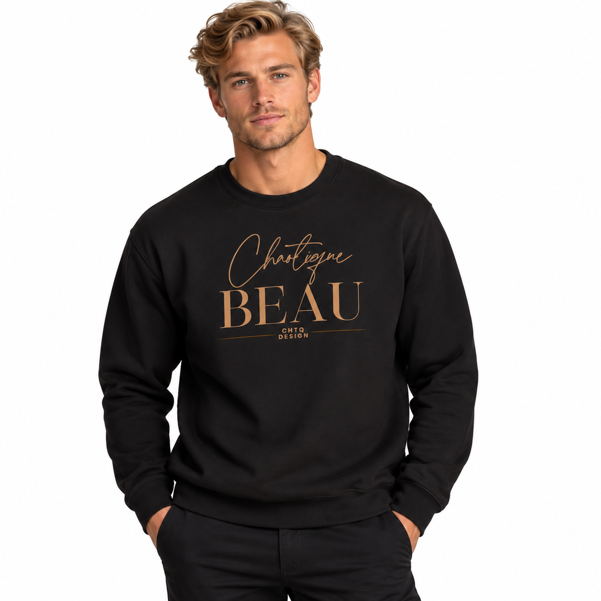 A man wearing a black crewneck sweatshirt with a metallic gold graphic print that reads 'Chaotique BEAU' and 'CHTQ DESIGN'.
