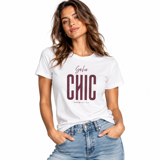 A woman wearing a white graphic t-shirt with 'soho CHIC' printed in maroon on the front, paired with light-wash blue jeans, against a plain white background.