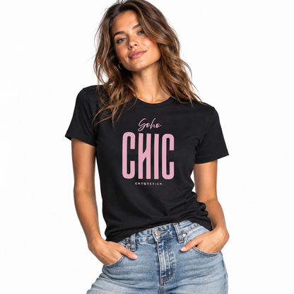A woman wearing a black short-sleeve graphic T-shirt with pink text reading 'soho CHIC' and light blue jeans, photographed against a clean white studio background.