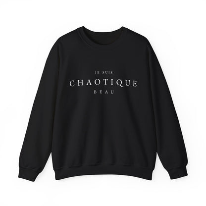 a black crewneck sweatshirt with the text 'JE SUIS CHAOTIQUE BEAU' printed in white across the chest