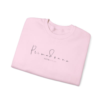 Folded PRIMADONNA by CHTQ Design light pink crewneck sweatshirt featuring elegant gray script lettering on the chest, front view on white background.
