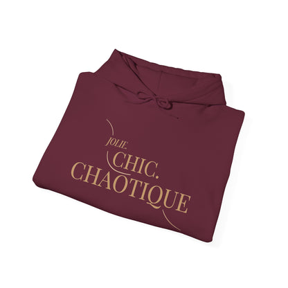 Folded maroon hoodie with graphic 'Jolie. chic. Chaotique' text on a white background
