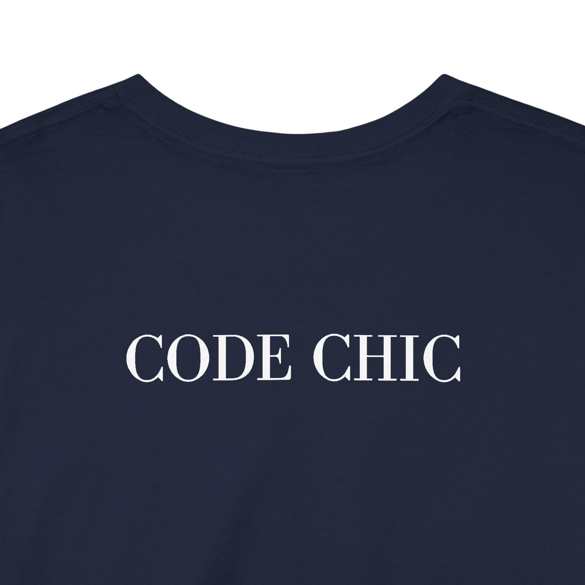 Close-up of a navy blue t-shirt with the words 'CODE CHIC' printed in white serif letters across the chest.