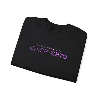 A black crewneck sweatshirt with text reading “CHIC BY CHTQ” and “REBELLE DANS L’ÂME” printed across the chest.