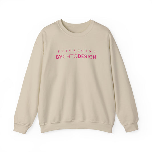 An beige crewneck sweatshirt featuring pink “PRIMADONNA BY CHTQ DESIGN” text across the chest, displayed against a clean white background.