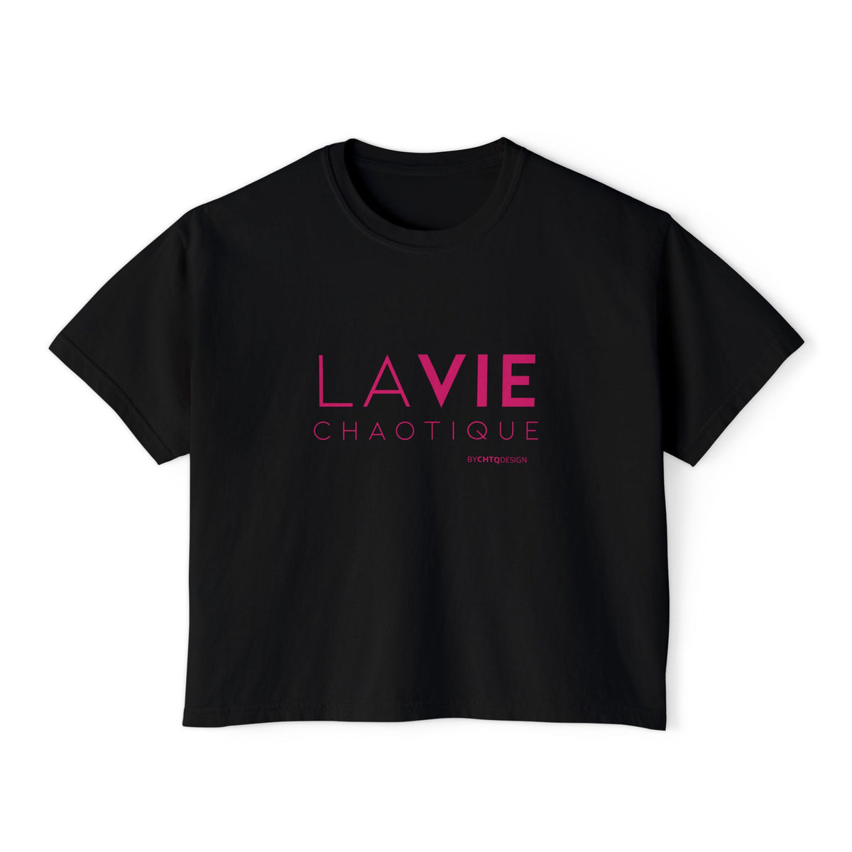 A black short-sleeve boxy T-shirt with a slightly cropped fit, featuring “LA VIE CHAOTIQUE” typography in pink on the front, displayed against a clean white background.