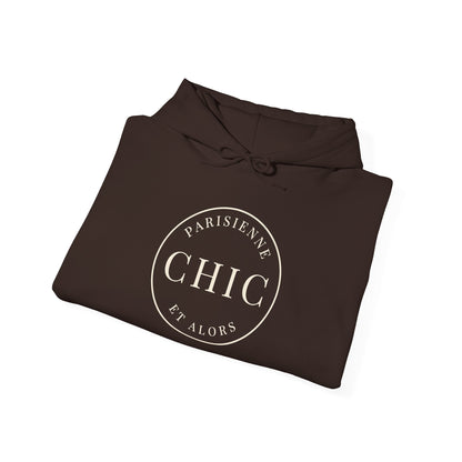 Folded brown hoodie featuring a cream circular “PARISIENNE CHIC ET ALORS” graphic on the front, displayed against a clean white background.