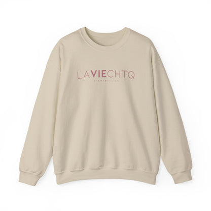 Beige crewneck sweatshirt with “LA VIE CHTQ” and “BY CHTQ DESIGN” printed in gold across the chest, displayed against a clean white background.