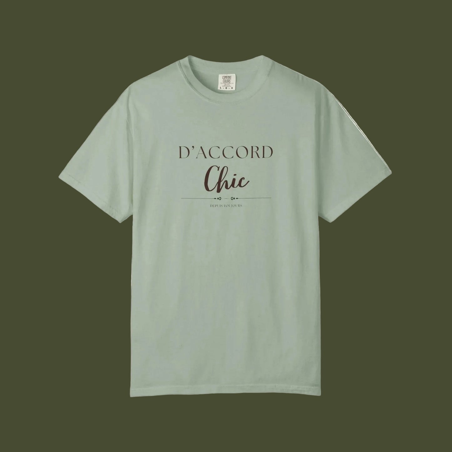 Green t-shirt with 'D'accord Chic' text on a white backgroun
