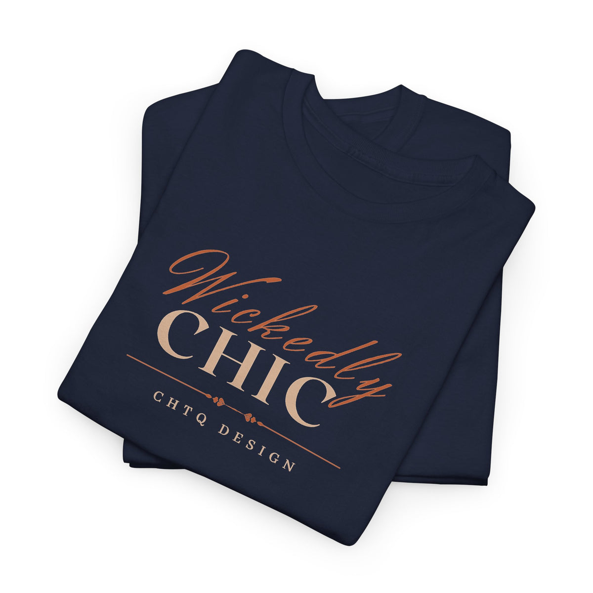 Folded Navy Wickedly Chic Graphic T-Shirt featuring elegant copper-colored script lettering, cream CHIC typography, and subtle CHTQ Design detailing on the front. Front view on a white background.