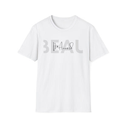 A white short-sleeve crewneck t-shirt with a graphic on the chest reading 'BEAU' in a large, faded gray font, with 'D'Accord' written in a black script font in the center.