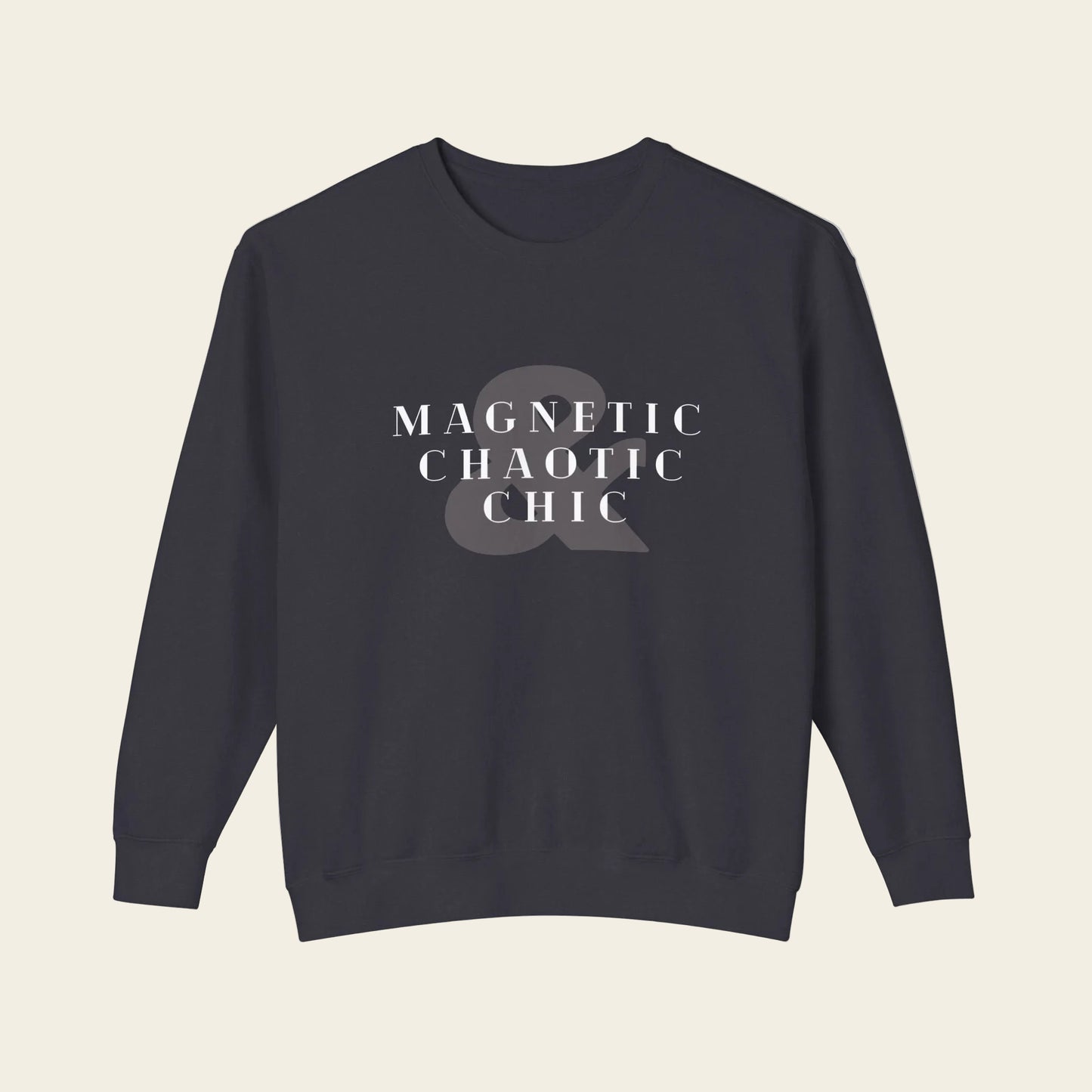 A dark navy crewneck sweatshirt with the phrase 'Magnetic Chaotic Chic' printed in white distressed capital letters across the chest