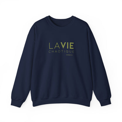 An navy crewneck sweatshirt with “LA VIE CHAOTIQUE” printed in olive green and “BY CHTQ DESIGN” beneath the graphic, displayed against a clean white background.