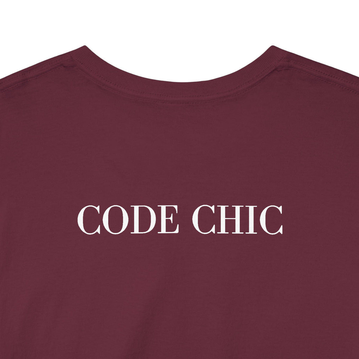 A close-up of a maroon crewneck t-shirt with the words 'CODE CHIC' printed in white serif capital letters across the chest, set against a plain white background.