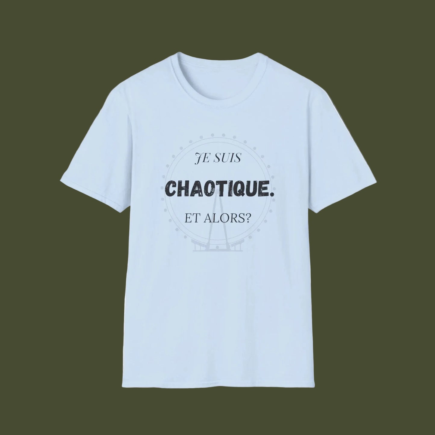 A light blue short-sleeve crewneck t-shirt with a black printed graphic on the chest reading 'JE SUIS CHAOTIQUE. ET ALORS?' inside a faint circular design, shown on a plain white background.