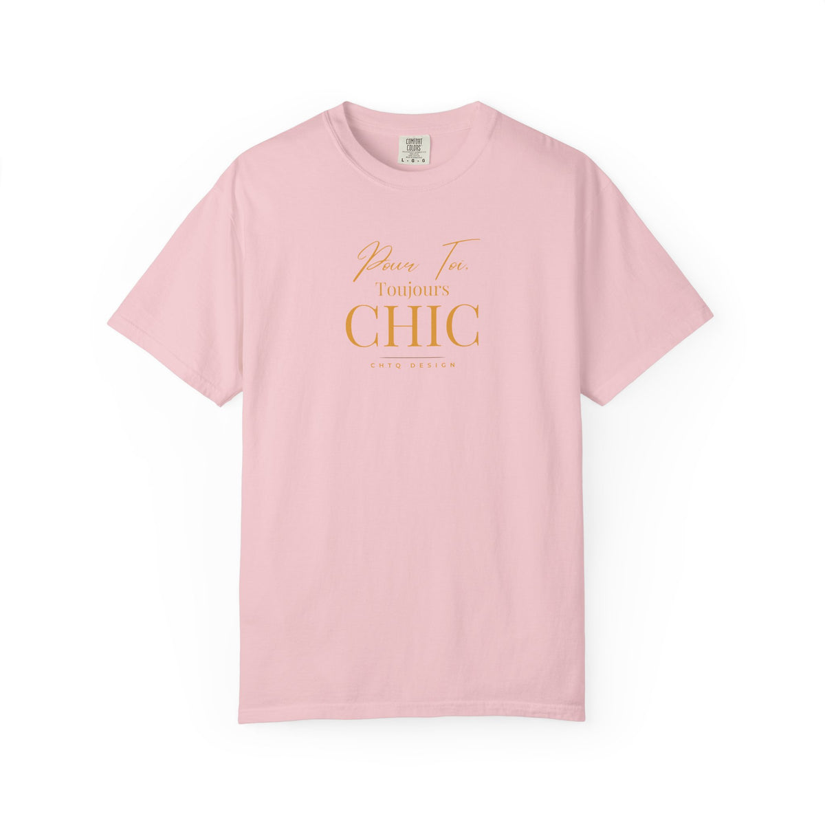 A pink CHTQ Design T-shirt with gold “Pour Toi. Toujours CHIC” typography on the front.