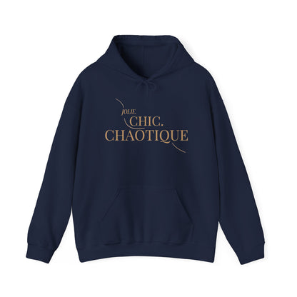 A navy blue Jolie Chic Chaotique Hoodie featuring an elegant gold “JOLIE. CHIC. CHAOTIQUE” typography graphic on the front, displayed against a clean white background.