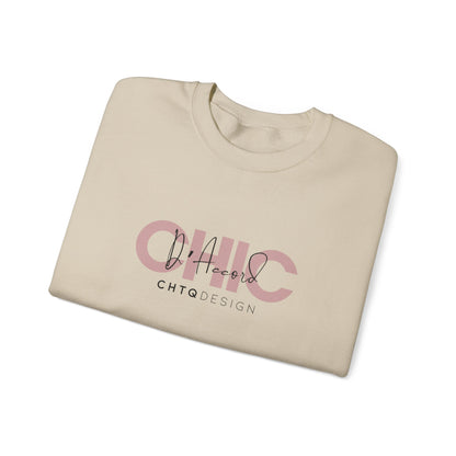 A folded CHIC D’Accord CHTQ Design sand crewneck sweatshirt with dusty rose graphic