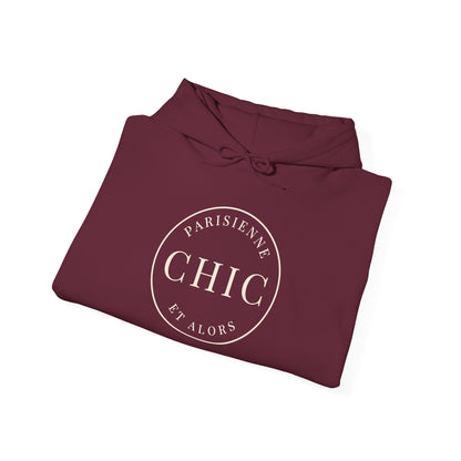 Folded maroon hoodie featuring a cream circular “PARISIENNE CHIC ET ALORS” graphic on the front, displayed against a clean white background.