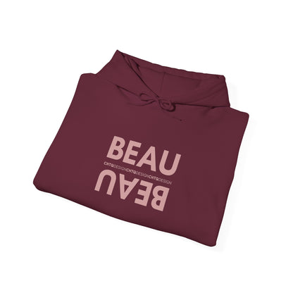 A folded maroon BEAU graphic hoodie with a mirrored dusty pink BEAU print and CHTQ Design detail on the chest, displayed against a white background.