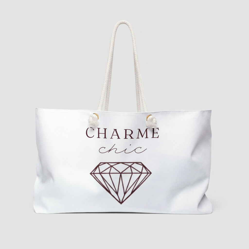 White weekender bag with graphic and text 'charme chic' 