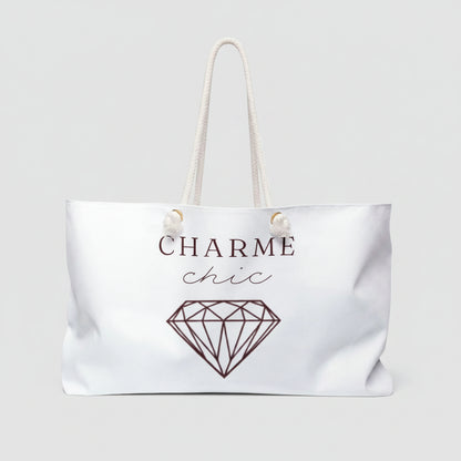 White weekender bag with graphic and text 'charme chic' 