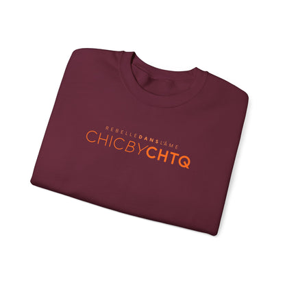 A maroon color crewneck sweatshirt with text reading “CHIC BY CHTQ” and “REBELLE DANS L’ÂME” printed across the chest.