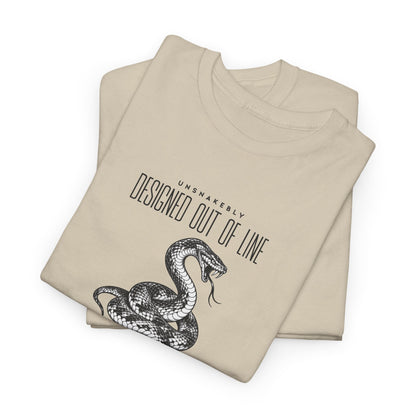 Folded cream beige UNSNAKEBLY graphic T-shirt showing the snake illustration and printed typography.