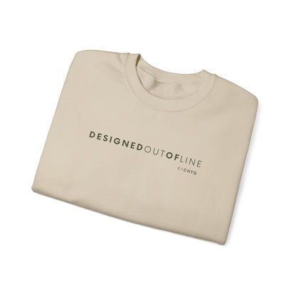 A folded beige crewneck sweatshirt featuring dark green “DESIGNED OUT OF LINE” text across the chest, with a small “BY CHTQ” detail underneath, displayed against a clean white background.