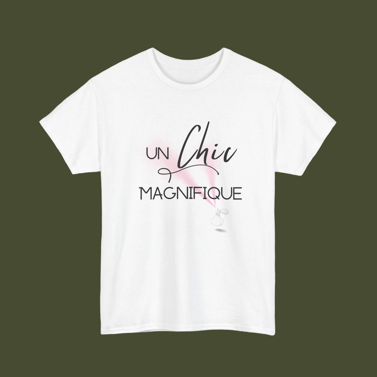 A white short-sleeve crewneck t-shirt featuring a French graphic print that reads 'UN Chic MAGNIFIQUE' in black script and block lettering, accented with a soft pink watercolor splash and a small white feather illustration.