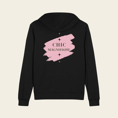 A black zip-up hoodie shown from the back, featuring a pink paint-stroke graphic with the words 'CHIC MAGNIFIQUE' in a gold serif font and small star accents.