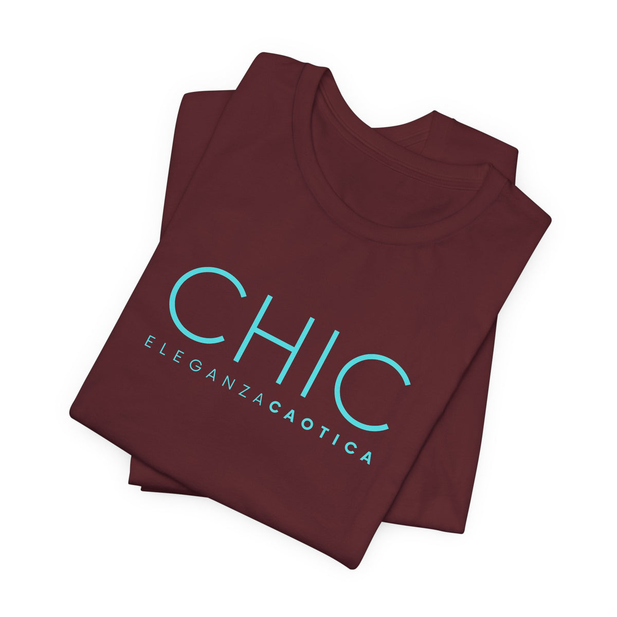 A folded maroon crewneck t-shirt with 'CHIC' printed in a light blue sans-serif font, and 'ELEGANZACAOTICA' printed underneath in smaller letters, shown on a plain white background.